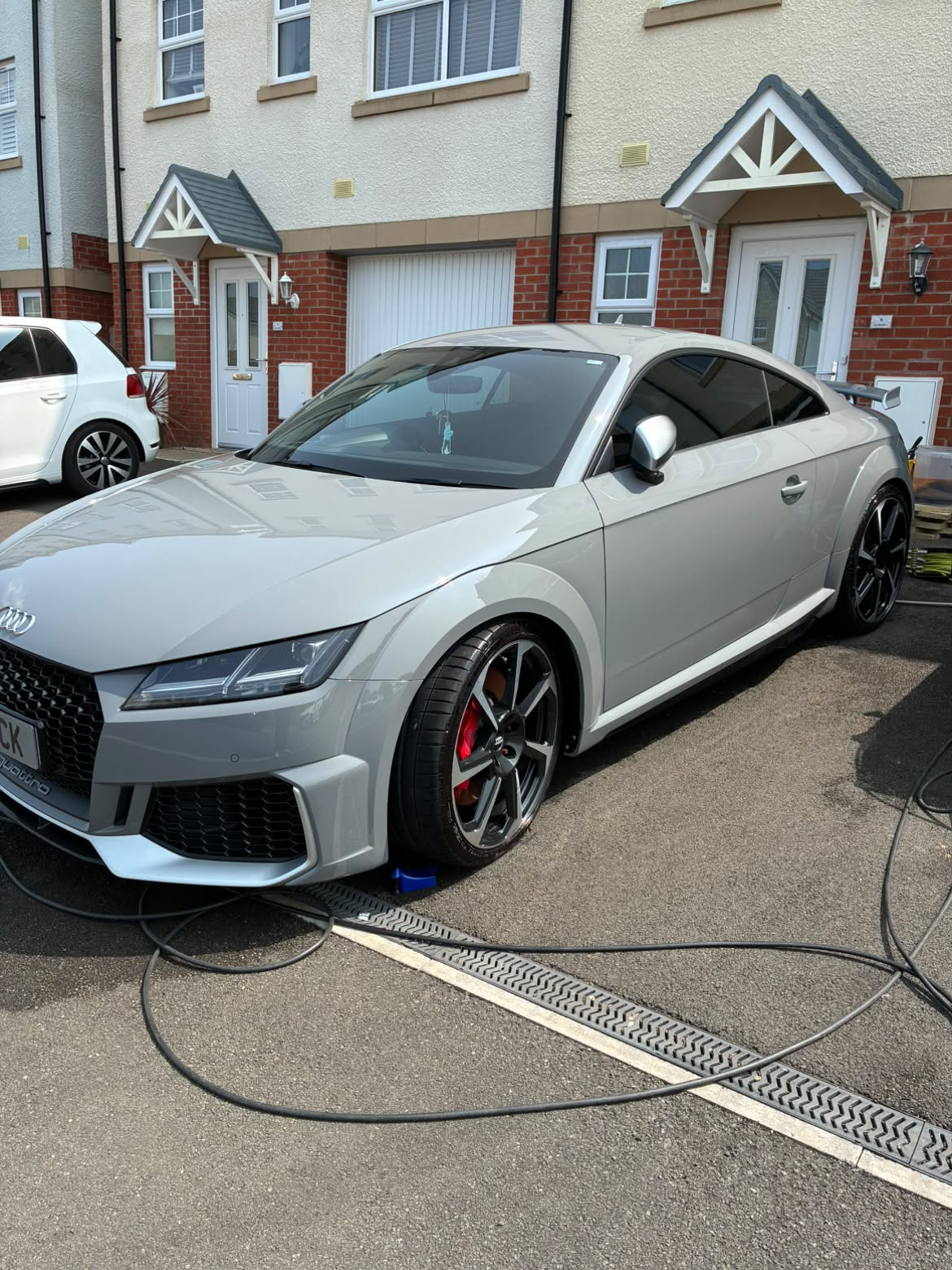 Paint correction result showing flawless gloss finish on car bodywork