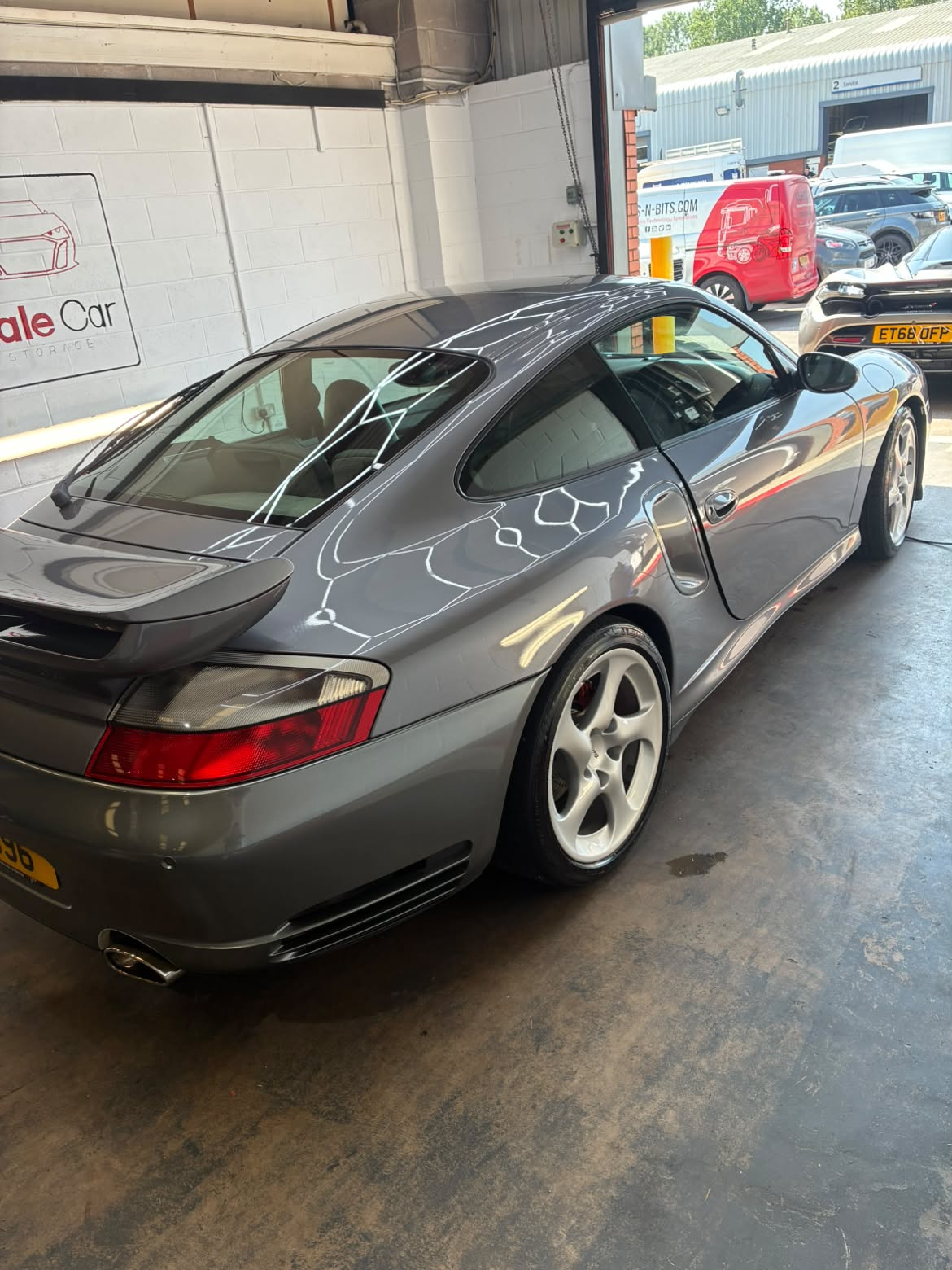 Premium gloss finish on vehicle exterior after professional detailing