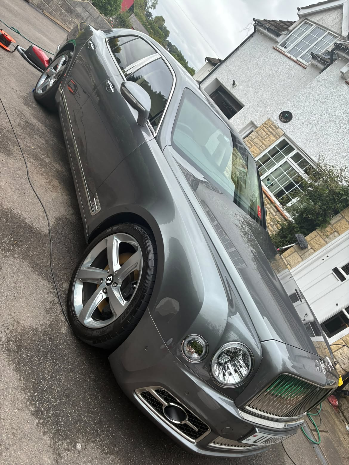Deep gloss detail result showcasing flawless reflective surface on vehicle